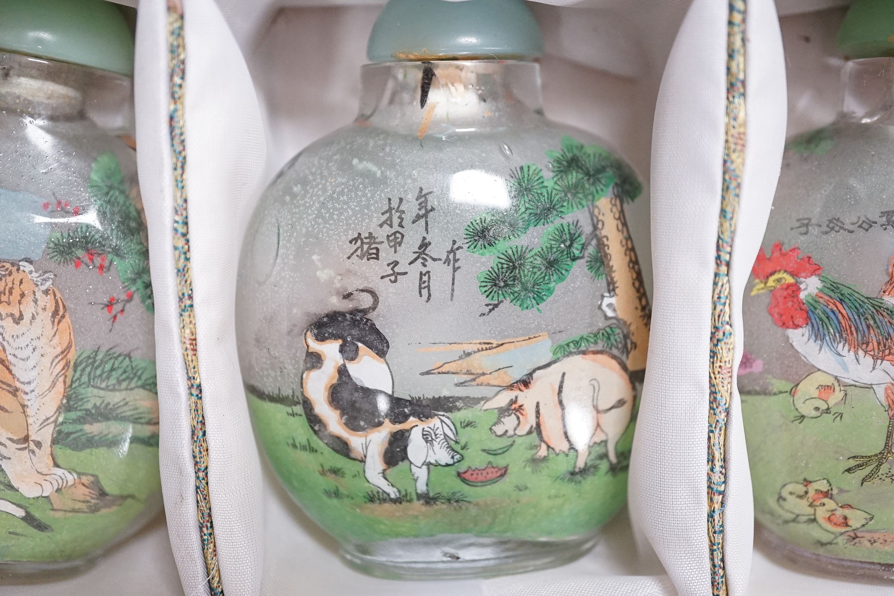 A boxed set of six Chinese inside-painted snuff bottles, height 8cm overall